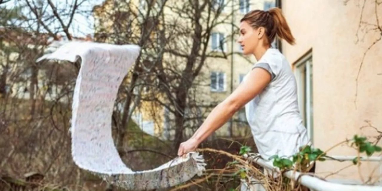 Komşu balkonuna halı silkeleyen kadına 3 ay hapis